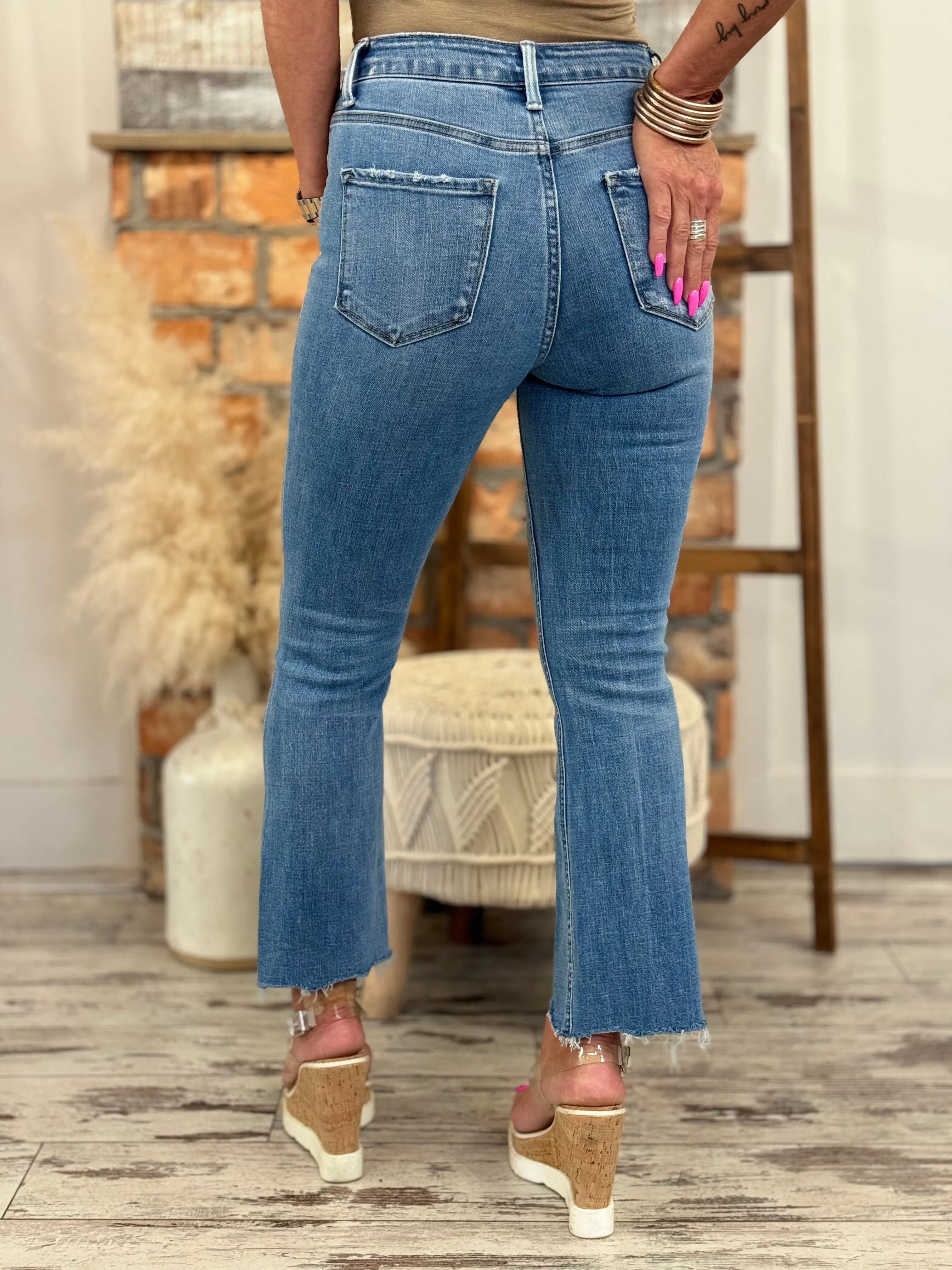 High Rise Asymmetric Hem Kick Flare Jeans