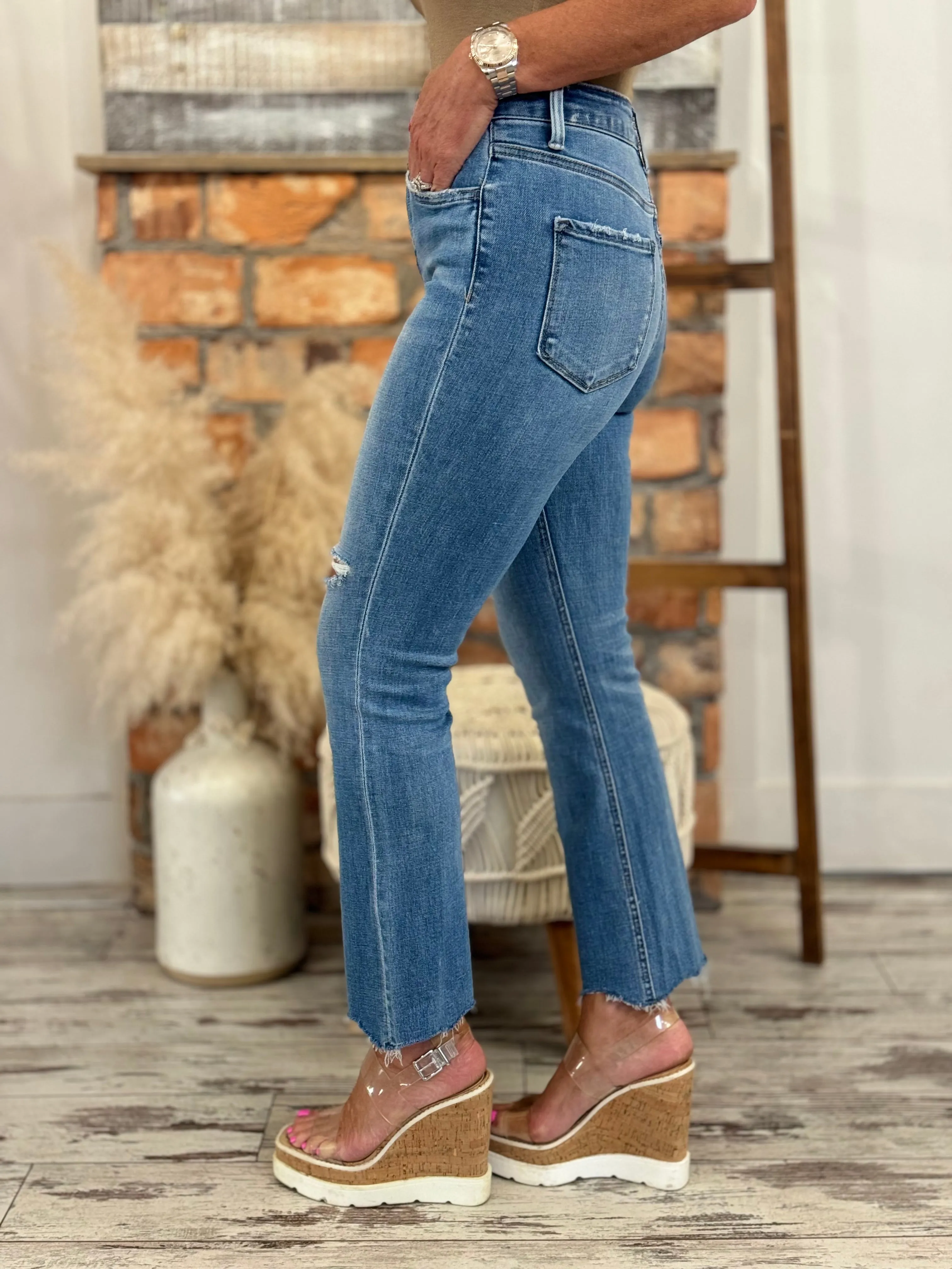 High Rise Asymmetric Hem Kick Flare Jeans